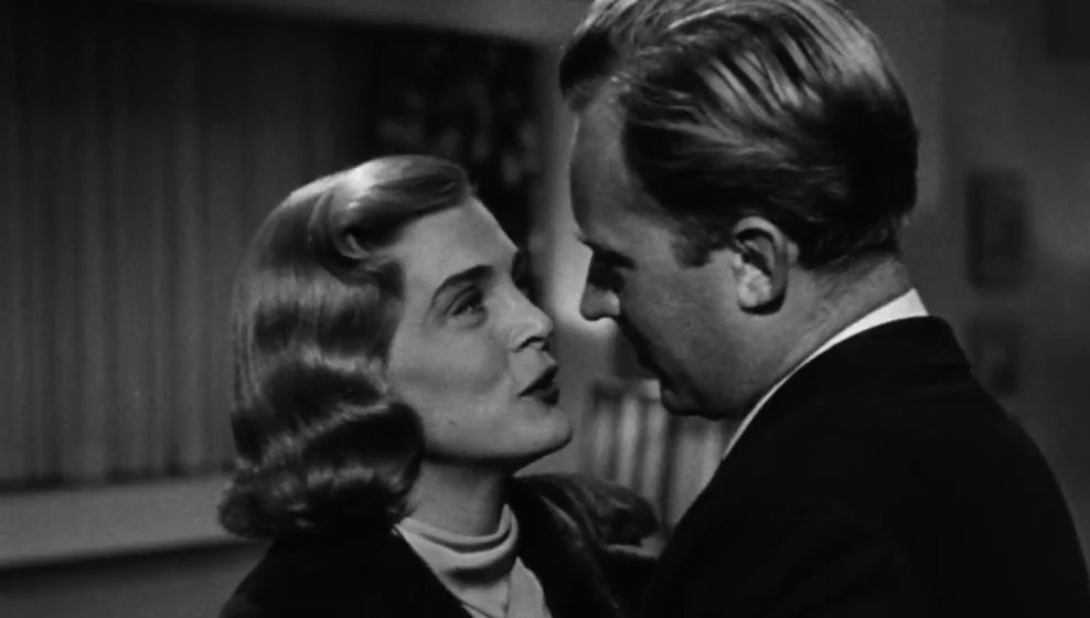 Lizabeth Scott looks up at Arthur Kennedy in a still from the 1949 film noir Too Late for Tears